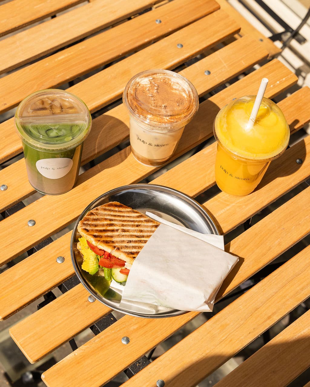 Matcha, iced coffee, fresh juice and a toasted sandwich in the sunshine at Pulp & Steam
